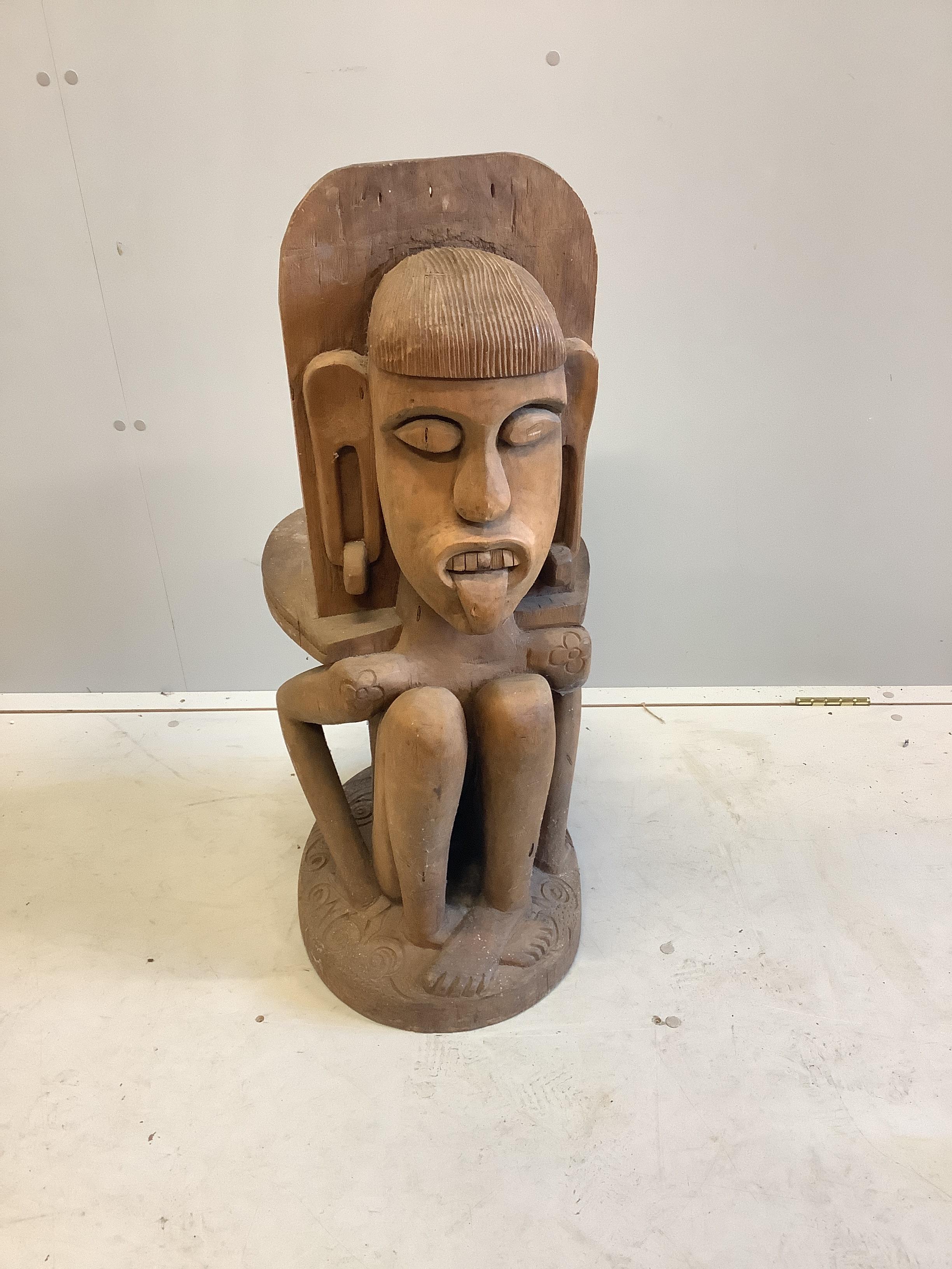 A Sarawak Iban people chair, height 87cm and a book 'Wild People'